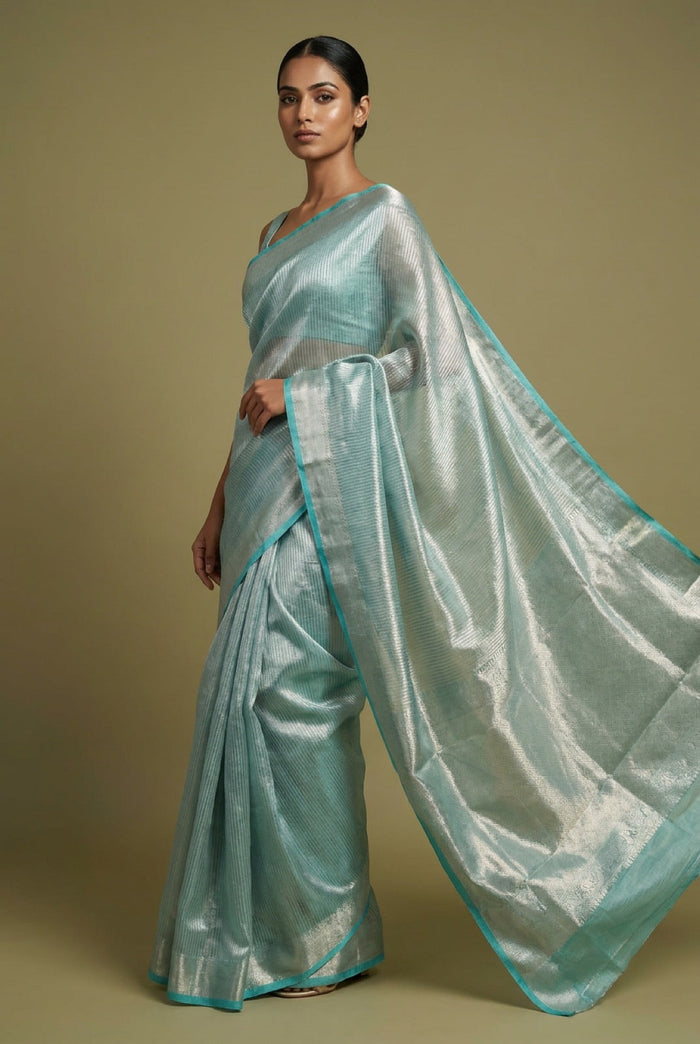 Celeste Silver Tissue Saree With Aqua Border